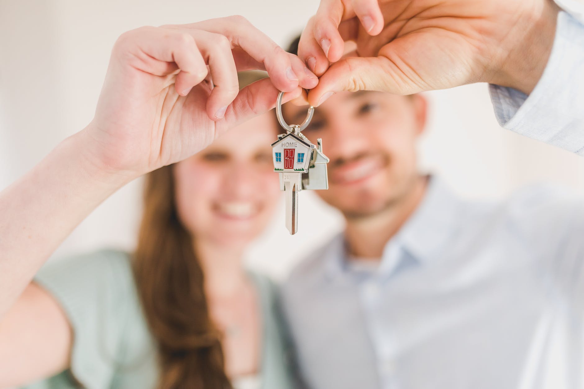 A couple holding the keys to their home.